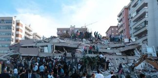 BBC, Reuters Flag U.S.-Made Killer Rescue workers and civilians on collapsed building after earthquake