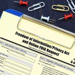 Birth Tourism Panic Meets 14th Amendment Wall FOIA request form on a clipboard with office supplies