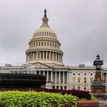 Trump Taps Housing Official to Lead Intel Community United States Capitol building with dome and fountain in foreground