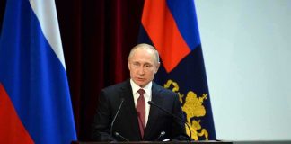 Did the CIA Tried to Assassinate Putin? speaker at podium with flags in background