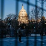 Alleged White House Perimeter Ambush Targets National Guard U.S. Capitol behind security fencing and guards on a street