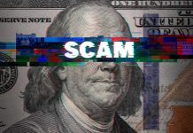 $25 Payment Caught on Undercover Video Draws DOJ Attention Close-up of a U.S. hundred-dollar bill with glitch effect and the word scam