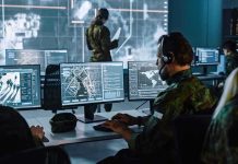 Trump’s ‘Permanent Control’ Claim Sparks Arctic Uproar Military analysts at computers in a command center