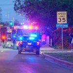 World Cup Night Turns Bloody Emergency vehicles with flashing lights on a city street at night