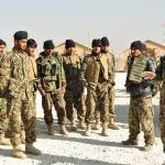 Terror Camp Standoff Ends — What Broke Them? Soldiers in camouflage gather outdoors for a briefing