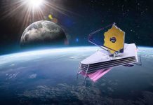 New Telescope Targets Invisible Universe space telescope with gold hexagonal mirror orbiting above Earth