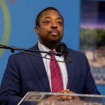 Senator Plots Supreme Court Power Play Man in suit speaking at a podium with a microphone
