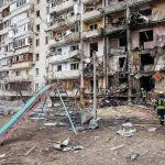 Civilian Pool Turned Kill Zone Damaged apartment building behind a playground slide