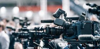 See What HATEFUL Radicals Did to Charlie Kirk’s Statue Broadcast cameras on tripods at a press event