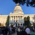 Leaked Plans Spark 4th Of July Outrage Crowd gathers before a neoclassical capitol building with dome