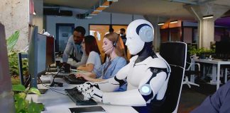 How AI Is Turning Unemployment Into a Major CRISIS Robot and office workers at computers in a modern workspace