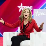 Blackburn Steamrolls: Tennessee Power Play Exposed Marsha Blackburn speaking on stage with arms outstretched