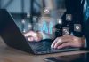 Paper Claims Claude Is Becoming Anthropic’s ‘GOD’ Hands typing on laptop with AI and tech icons overlay