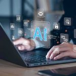Paper Claims Claude Is Becoming Anthropic’s ‘GOD’ Hands typing on laptop with AI and tech icons overlay