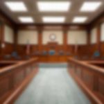 TikTok Bounty Sparks Federal Firestorm Empty courtroom with wooden benches and judge's bench