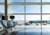 FAA FORCED to Stop Planes at Newark and Philadelphia Airport terminal with plane at gate viewed through large windows