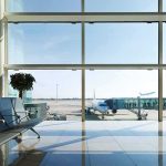FAA FORCED to Stop Planes at Newark and Philadelphia Airport terminal with plane at gate viewed through large windows