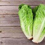 Taco Bell Lettuce Tied To 1,600 Sick Romaine lettuce hearts on rustic wooden table