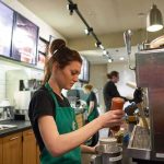 SpaceX Payday Shocks Wall Street Barista preparing a drink at a coffee shop counter