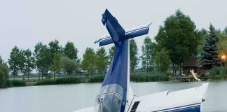 SICK! See How This Reporter Treated Tom Tiffany’s Plane Crash A submerged airplane partially in a lake with trees in the background