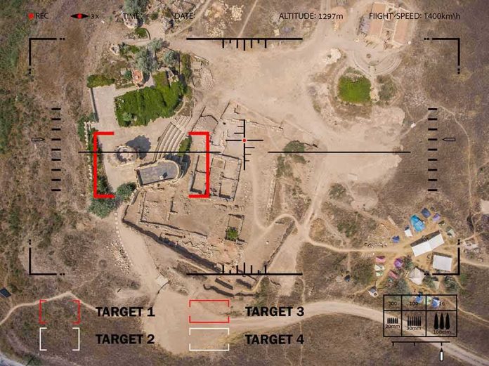 shutterstock_500925580 Aerial view through drone HUD of archaeological ruins and surrounding campsite