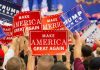 N-Word Bomb Dropped By Former GOP Advisor Crowd holding red and blue campaign signs at a political rally