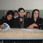 Tuition Trap: System Won, Students Paid Sihem Habchi and other women seated at a classroom desk