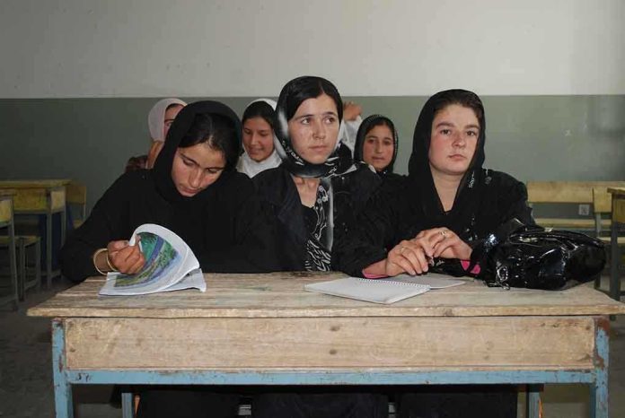 Sihem Habchi and other women seated at a classroom desk