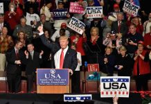 Trump Booed at Presidents Cup? WATCH the Tape Donald Trump addresses a rally crowd at a podium, raising his fist
