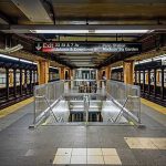 Knicks Fans Brace for Trump’s Surprise Visit Subway platform with stairwell and tracks on both sides
