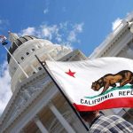 Newsom Claims ‘Trump’s Hit List’ California state flag in front of a white domed capitol building