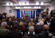 Team Trump Drops BRUTAL Receipt on CNN Press secretary at podium addressing reporters in briefing room