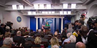 Team Trump Drops BRUTAL Receipt on CNN Press secretary at podium addressing reporters in briefing room