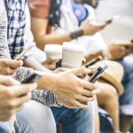 THIS Could Make Your Brain 13 Years Younger! Group of people sitting and using smartphones