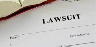 NYC Says Law Firm FAKED Slip-and-Fall Claims Lawsuit document with a pen and book.