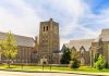 Gothic-style university building with central stone tower