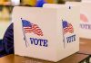 Democrats SPLIT Over Their Own Senate Pick voting booth with American flag graphics