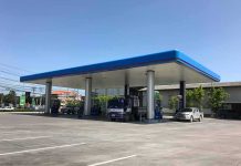 Gas Station DRUG Tied to College Student Deaths Gas station canopy with fuel pumps and vehicles on a clear day