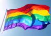 Jesuits REJECT Man Who Questioned LGBT Priest Rainbow pride flag waving against a clear blue sky
