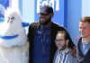 LeBron James and Channing Tatum pose with a mascot and another attendee