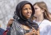 Feds Left Ilhan Omar Unable to Phone HOME Ilhan Omar wearing a black headscarf at an outdoor event