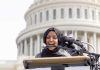 Ilhan Omar Doubles Down on ABOLISHING ICE Woman in hijab speaking at podium with microphones