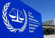 Rubio Hits International Criminal Court With SANCTIONS International Criminal Court sign with scales emblem outside modern building