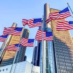 Iconic Chrysler Building Finally SOLD American flags waving before modern glass skyscrapers