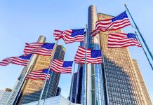 Iconic Chrysler Building Finally SOLD American flags waving before modern glass skyscrapers