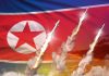 Report Warns Of North Korea’s Latest NUKE Program North Korean flag with missiles launching and smoke trails