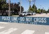 Congress Says Illinois Let 500 Migrants WALK Police line barrier blocking a street with patrol vehicles behind