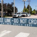 Congress Says Illinois Let 500 Migrants WALK Police line barrier blocking a street with patrol vehicles behind