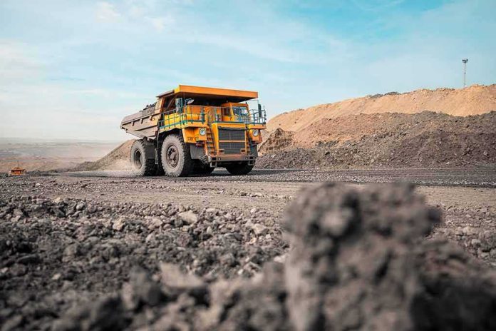 shutterstock_2021454443 Mining haul truck driving through an open-pit mine
