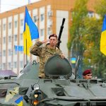 Trump Tallies What Ukraine Has COST You Soldiers on armored vehicle with Ukrainian flags